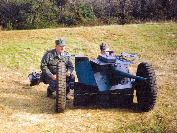 Leon and Ralph  Lovett in WW II German Anti Tank Cannoneer uniforms and a 3,7cm. Panzer Abwehr Kanone (PAK) 1936