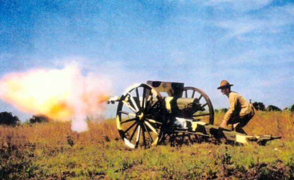 75 mm mle 1897 "French 75mm" being fired by Ralph Lovett in a pre-WW I US uniform for artillery 