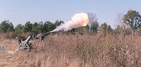 Adrian Winget, Leon, and Ralph Lovett firing s.F.H. 02